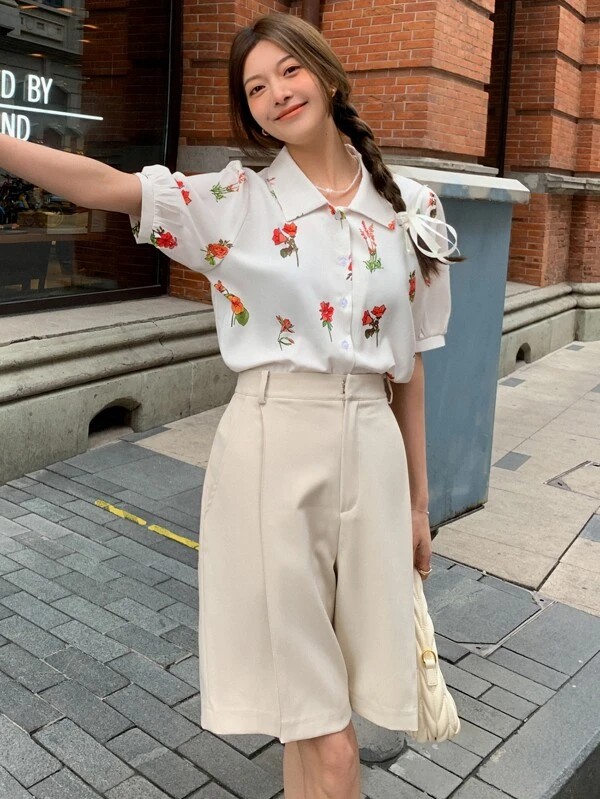 Camicia stampa floreale manica sbuffo bottone frontale