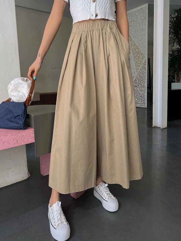 Pantaloni a gamba larga monocolore con tasca inclinata