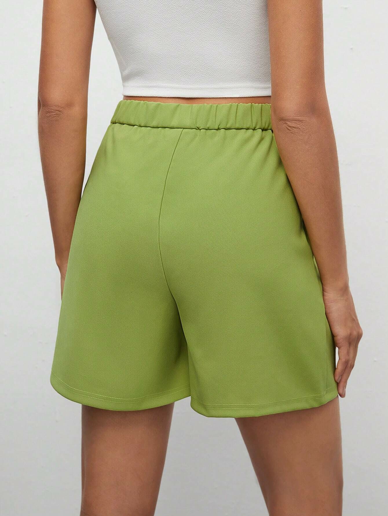 Shorts monocolore tasca inclinata
