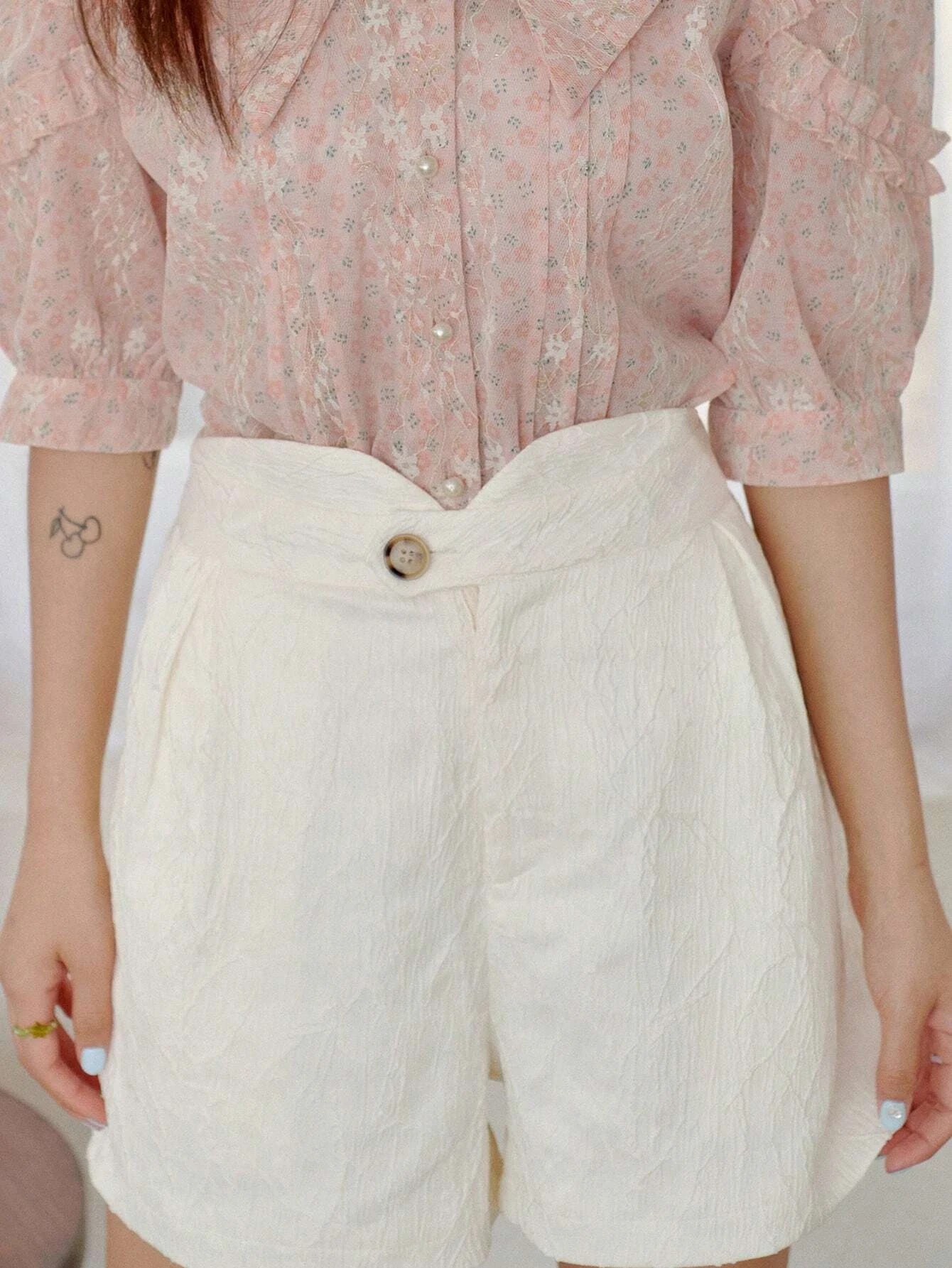 Shorts con gamba ampia plissettato