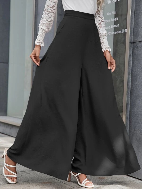 Pantaloni palazzo con tasche oblique e chiusura a cerniera