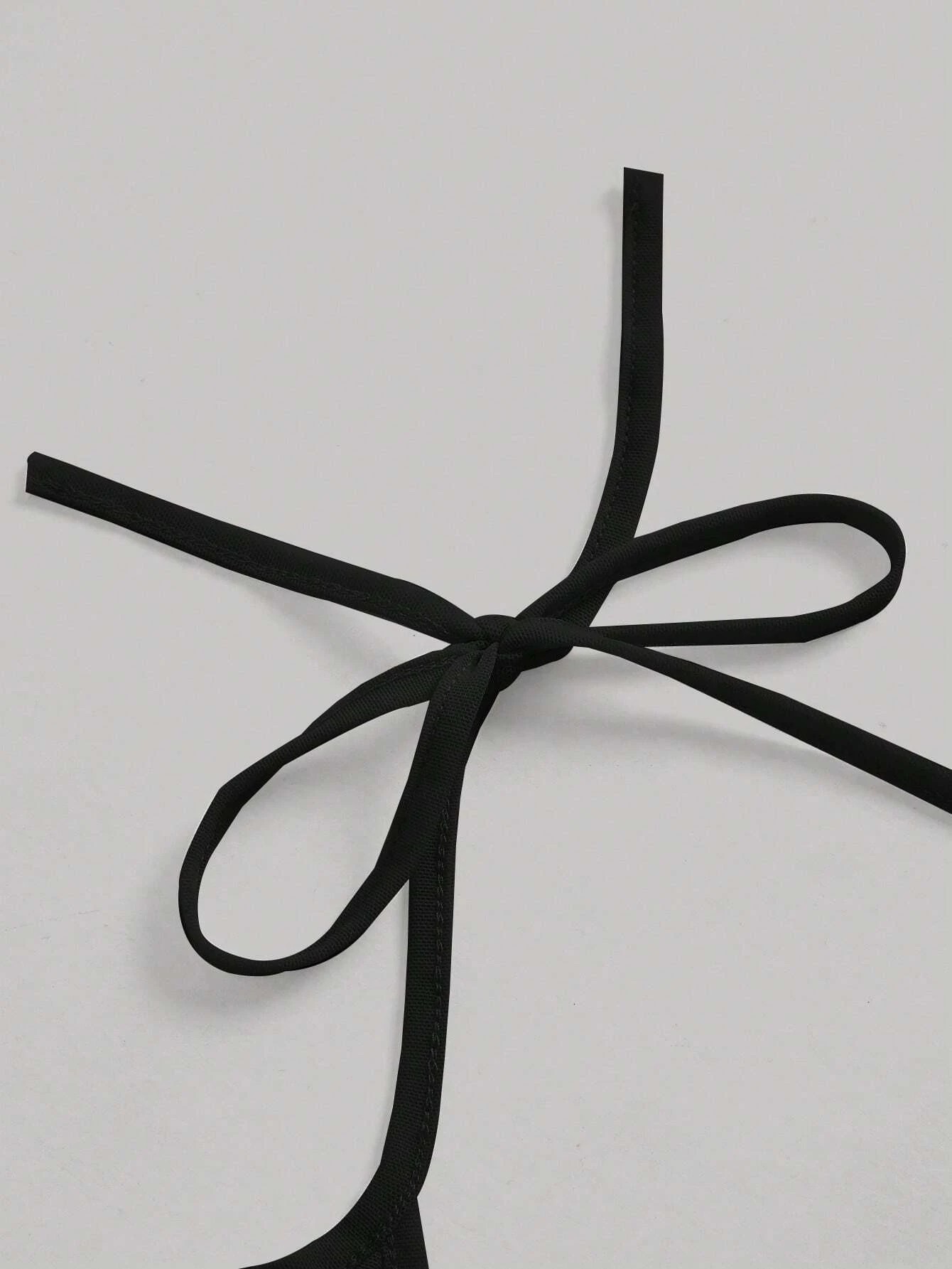 Top corto con bretelle sottili monocolore.