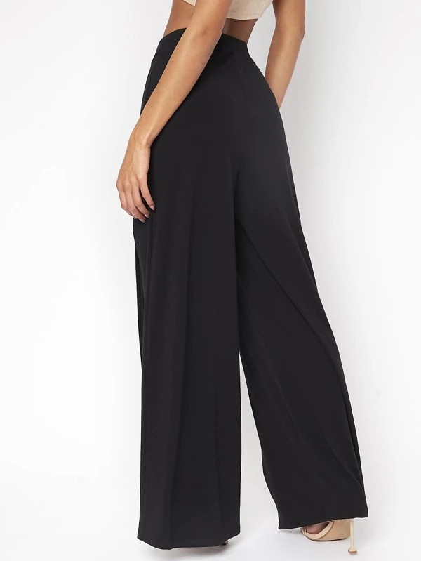 Pantaloni monocolore fessura alta