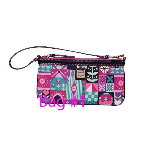 Disney Dooney and Bourke Bag - it's a small world - Wristlet